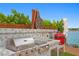 Outdoor kitchen with grill and unique design, near tranquil waterfront at 2250 Donato Dr, Belleair Beach, FL 33786