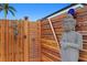 Private outdoor shower with decorative wood paneling and unique artistic touches at 2250 Donato Dr, Belleair Beach, FL 33786