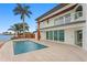 Gorgeous waterfront home featuring a private pool and spacious patio with stunning water views at 2250 Donato Dr, Belleair Beach, FL 33786