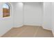 Bright room featuring an arched window with a picturesque neighborhood view at 2250 Donato Dr, Belleair Beach, FL 33786