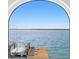 Beautiful arched window view of the boat dock and clear, blue water at 2250 Donato Dr, Belleair Beach, FL 33786