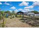 Backyard featuring a gazebo and storage shed on a sunny day at 2360 Sutton Pl, Spring Hill, FL 34608