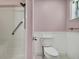 Bathroom featuring a toilet and standup shower with accessible grab bars at 2360 Sutton Pl, Spring Hill, FL 34608