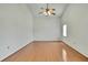 Bright and open bedroom featuring wood floors and large window at 2360 Sutton Pl, Spring Hill, FL 34608