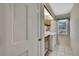 Bright laundry room featuring tile floors, a window, and washer and dryer at 2360 Sutton Pl, Spring Hill, FL 34608