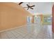 Living room showcasing vaulted ceilings, tile floors, and a view of the front entrance at 2360 Sutton Pl, Spring Hill, FL 34608