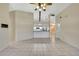 A bright and airy living room boasts tile flooring and a ceiling fan at 2360 Sutton Pl, Spring Hill, FL 34608