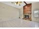 Spacious living room boasting a stone fireplace, vaulted ceilings, and tile flooring at 2360 Sutton Pl, Spring Hill, FL 34608
