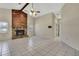 Living room features a stone fireplace, vaulted ceilings, and tile floors at 2360 Sutton Pl, Spring Hill, FL 34608