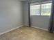 Bedroom with tile floors and lots of natural light coming in through the window with blinds at 2434 Australia E Way # 22, Clearwater, FL 33763