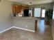 Bright kitchen featuring tile flooring, breakfast bar, and stainless steel appliances, perfect for modern living at 2434 Australia E Way # 22, Clearwater, FL 33763