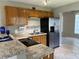 Modern kitchen featuring stainless steel appliances, countertops, and wooden cabinets for a contemporary look at 2434 Australia E Way # 22, Clearwater, FL 33763
