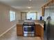 Modern kitchen featuring stainless steel appliances, countertops, and breakfast bar with seating for entertaining at 2434 Australia E Way # 22, Clearwater, FL 33763