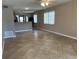 Well-lit living room featuring tile flooring with a breakfast bar overlooking the kitchen at 2434 Australia E Way # 22, Clearwater, FL 33763