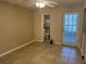 Living room includes tile floors, access to bathroom, and glass paned back door at 2434 Australia E Way # 22, Clearwater, FL 33763