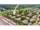 An aerial view shows the property's location among lush greenery and community amenities at 2529 Harn Blvd # 2, Clearwater, FL 33764