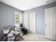 Neutral bedroom featuring a closet, window, changing table and bassinet at 2529 Harn Blvd # 2, Clearwater, FL 33764
