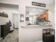 Home entryway showing a partial view of the kitchen and a decorated hallway at 2529 Harn Blvd # 2, Clearwater, FL 33764