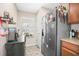 Bright kitchen area with stainless steel refrigerator, countertop and window at 2529 Harn Blvd # 2, Clearwater, FL 33764