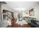 Hardwood floor living room with a sofa, sliding glass door, staircase, and nice decorations at 2529 Harn Blvd # 2, Clearwater, FL 33764