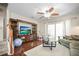 Living room with hardwood floors, sliding glass doors, a ceiling fan, and a comfortable sofa at 2529 Harn Blvd # 2, Clearwater, FL 33764