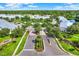 Aerial view of a well-manicured community with lush landscaping and a community pool at 26514 Chimney Spire Ln, Wesley Chapel, FL 33544
