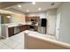 Bright kitchen featuring stainless steel appliances and wood cabinets at 26514 Chimney Spire Ln, Wesley Chapel, FL 33544