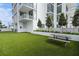 The building's amenity lawn offers a picnic table and manicured landscaping at 301 1St S St # 2305, St Petersburg, FL 33701