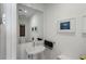 Modern half bathroom with pedestal sink and stylish mirror at 301 1St S St # 2305, St Petersburg, FL 33701