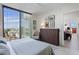 Modern bedroom featuring a large window with city views and view into adjacent living area at 301 1St S St # 2305, St Petersburg, FL 33701