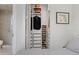 Walk-in closet with custom shelving, drawers, and wine rack and access to a glass shower at 301 1St S St # 2305, St Petersburg, FL 33701