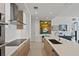 Modern kitchen with stainless steel appliances, white countertops, and wood-grain cabinetry at 301 1St S St # 2305, St Petersburg, FL 33701