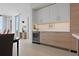 Modern kitchen with custom cabinets, a wine cooler, and an adjacent dining area at 301 1St S St # 2305, St Petersburg, FL 33701