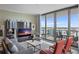 Bright living room with floor-to-ceiling windows, a balcony, and comfortable seating at 301 1St S St # 2305, St Petersburg, FL 33701