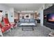Open-concept living room with a modern sofa, a coffee table, and a view into the contemporary kitchen at 301 1St S St # 2305, St Petersburg, FL 33701