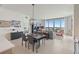 Open living space featuring dining area and living room with city views from floor to ceiling windows at 301 1St S St # 2305, St Petersburg, FL 33701