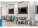 The community lounge area has comfortable seating and wall-mounted televisions at 301 1St S St # 2305, St Petersburg, FL 33701