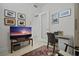 Inviting office space featuring stylish decor and a modern desk with artwork and flat screen tv at 301 1St S St # 2305, St Petersburg, FL 33701