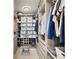 Organized walk-in closet features custom shelving, ample storage bins, and a convenient bench seat at 301 1St S St # 2305, St Petersburg, FL 33701