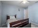 This cozy bedroom features a window and neutral colored walls at 32201 Brookstone Dr, Wesley Chapel, FL 33545