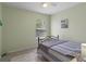 Comfortable bedroom features a window and neutral colored walls at 32201 Brookstone Dr, Wesley Chapel, FL 33545