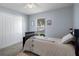 This cozy bedroom features a window and a closet at 32201 Brookstone Dr, Wesley Chapel, FL 33545