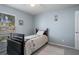 This cozy bedroom features a window and neutral colored walls at 32201 Brookstone Dr, Wesley Chapel, FL 33545