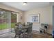 Cozy dining area with sliding glass doors that provide natural light and backyard views at 32201 Brookstone Dr, Wesley Chapel, FL 33545
