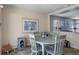 Inviting dining area with light blue walls and a cat tower and bed at 32201 Brookstone Dr, Wesley Chapel, FL 33545