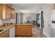 Open kitchen layout with granite countertops, leading to a dining area at 32201 Brookstone Dr, Wesley Chapel, FL 33545