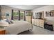 Well-decorated main bedroom with a large dresser and TV at 32201 Brookstone Dr, Wesley Chapel, FL 33545