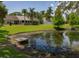 Water view from backyard with pond, mature trees, and lawn offering a serene outdoor space and water view at 333 Bay Pl, Safety Harbor, FL 34695