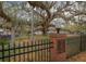 A view of the South Daytona Riverfront Park featuring a large oak tree and decorative fencing at 333 Bay Pl, Safety Harbor, FL 34695