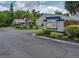 Entrance to BayTowne Villas showcasing the community's well-maintained landscaping and welcoming signage at 333 Bay Pl, Safety Harbor, FL 34695